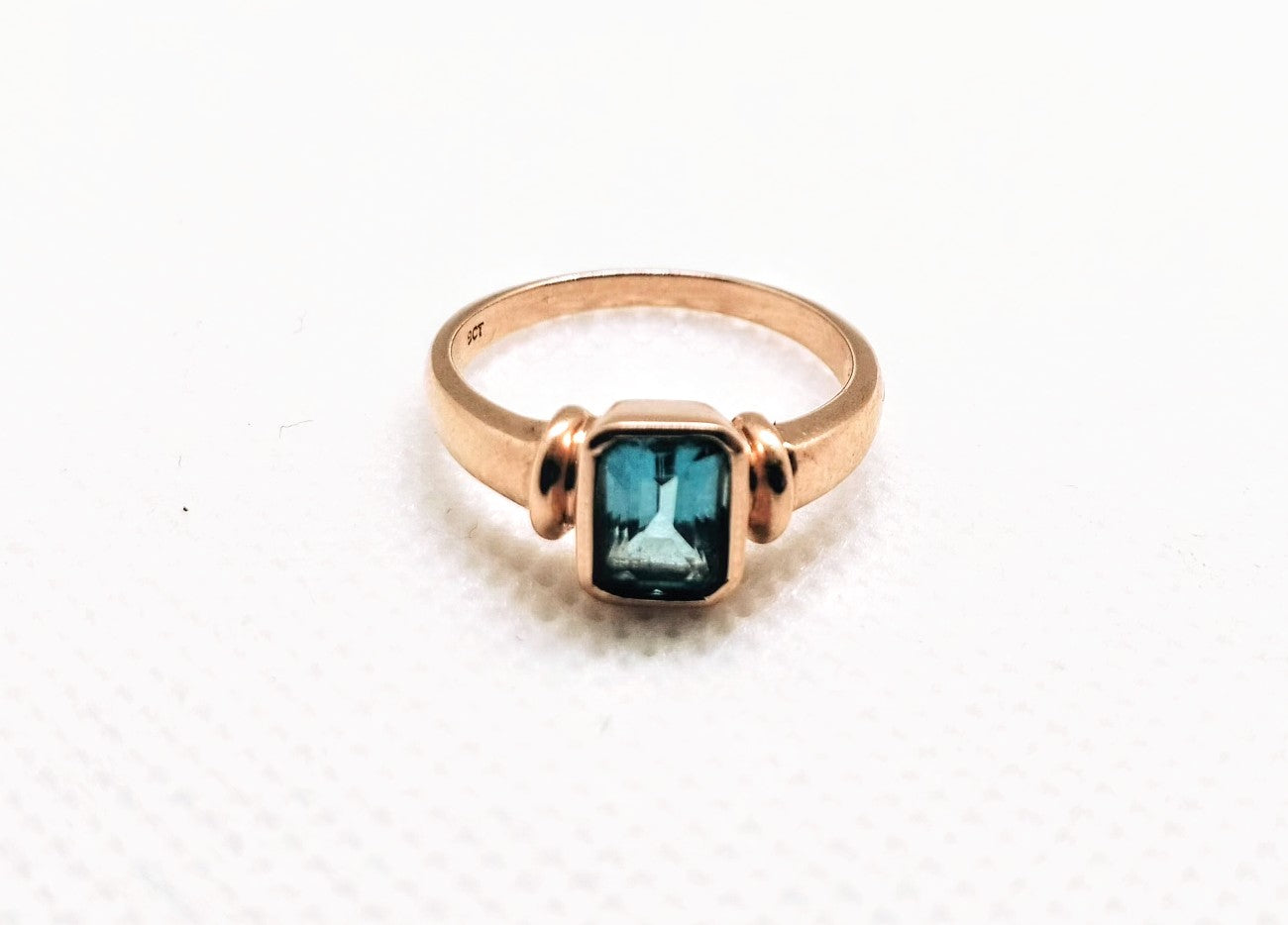 9ct rose gold and blue topaz ring